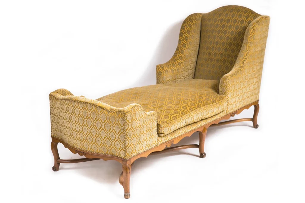 Decorating with Antique Furniture: Seeing the Potential in Period Pieces 11 This chaise longue is transformed from old fashioned to sleek and modern through fabric application.